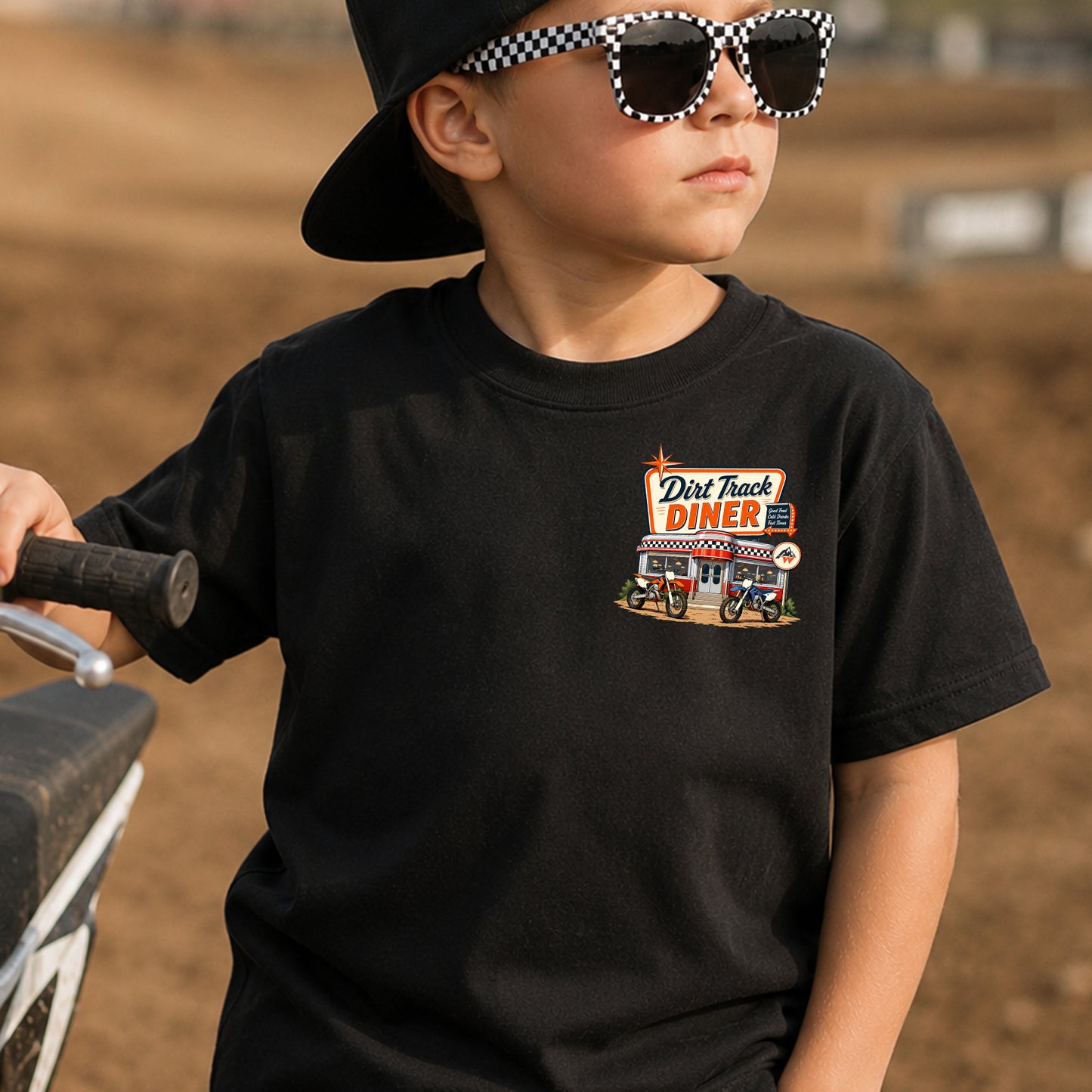 Kid wearing the Dirt Track Diner dirt bike t-shirt