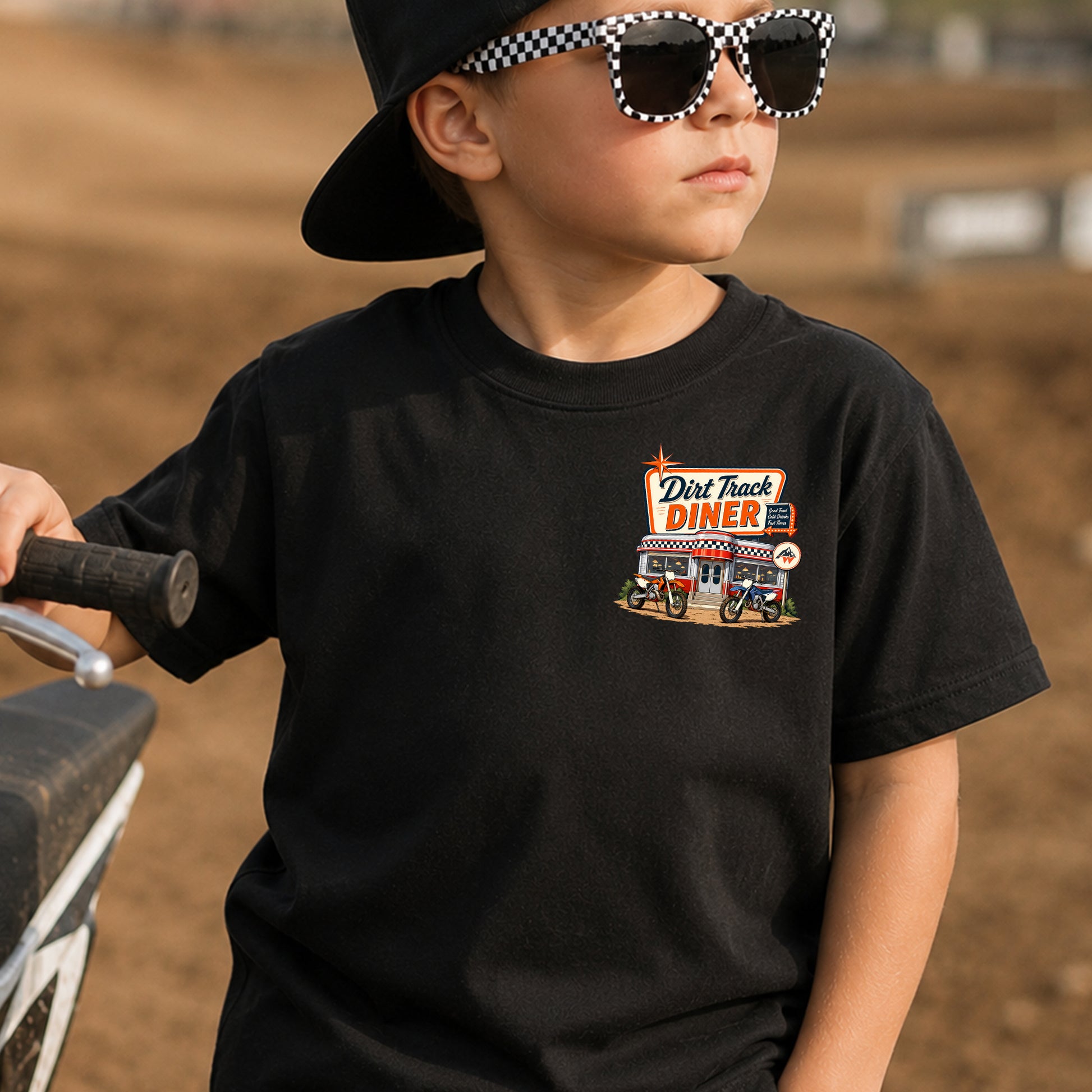 Kid wearing the Dirt Track Diner dirt bike t-shirt