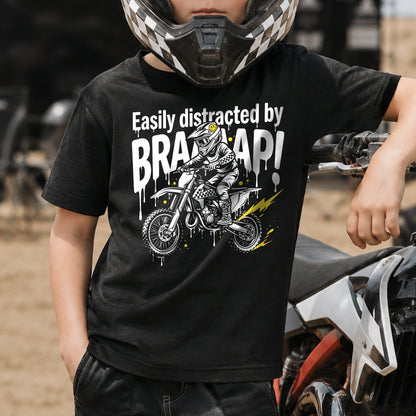 Kid wearing the Easily Distracted by Braaaap dirt bike t-shirt