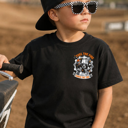 Kid wearing the Fuel the Fire, Shred the Tire dirt bike t-shirt