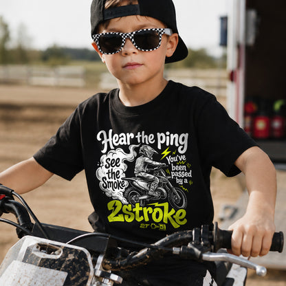 Kid wearing the Hear the Ping, See the Smoke - You've Been Passed dirt bike t-shirt
