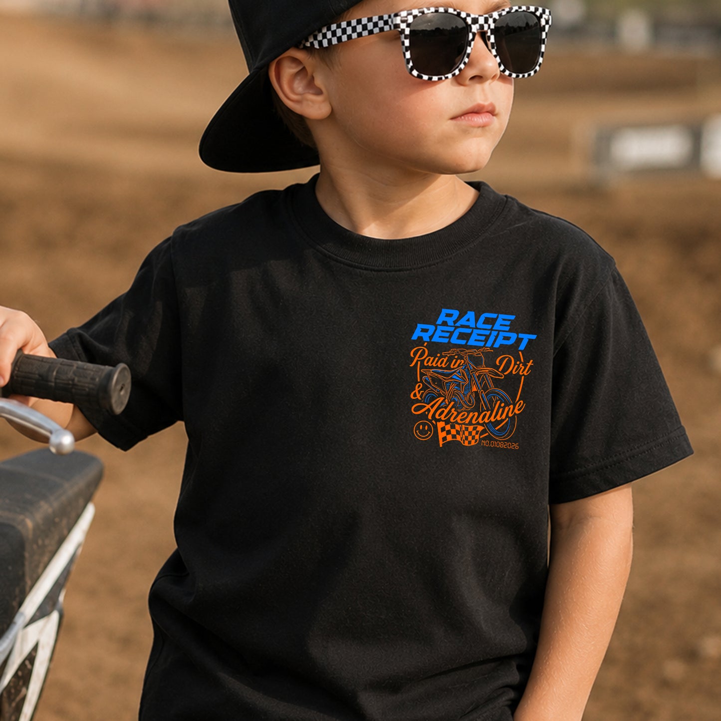 Kid wearing the Race Receipt dirt bike t-shirt